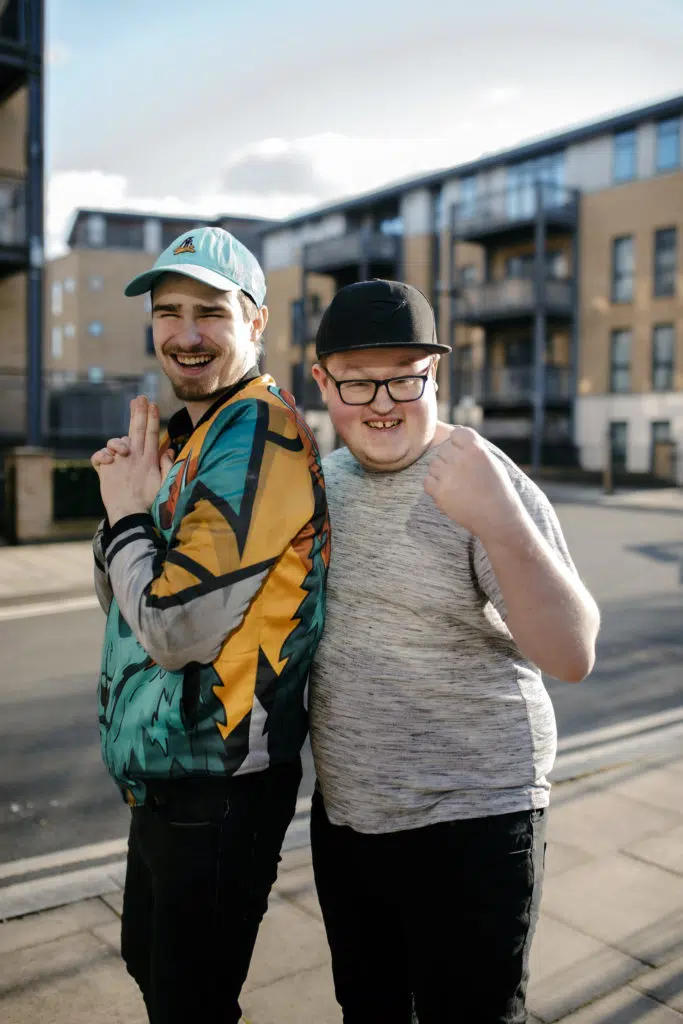 Ozzy and Aaron stood outside smiling and laughter