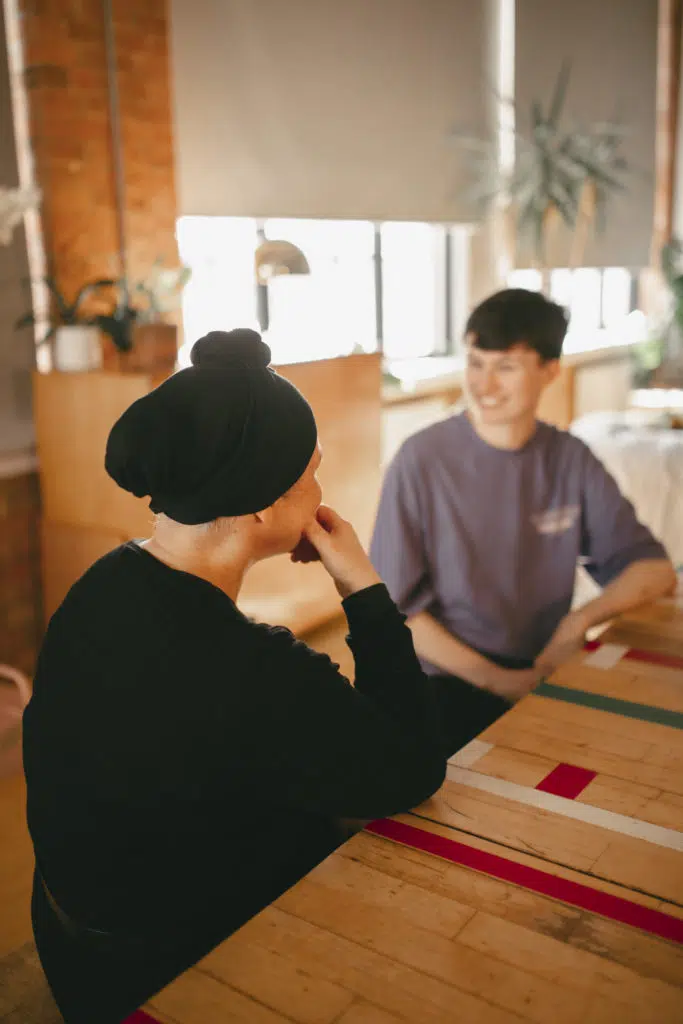 Professional and young person in conversation