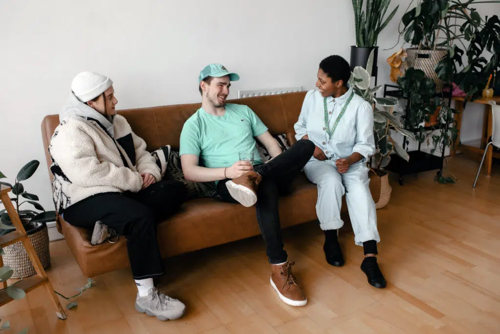 Beth, Will and Aaron speaking on the sofa