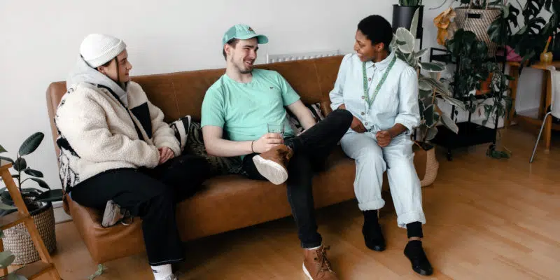 Beth, Will and Aaron speaking on the sofa
