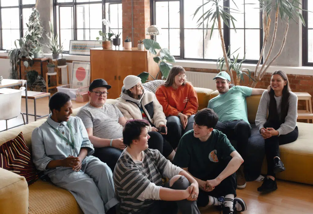 Large group of young people having a conversation together