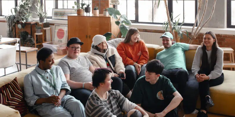 Large group of young people having a conversation together