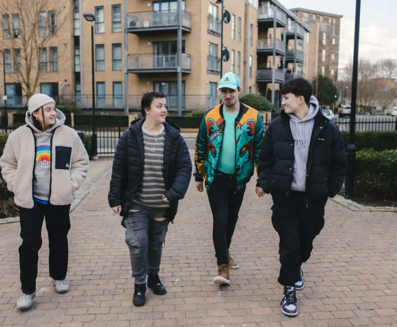 Group of young people in conversation, walking together