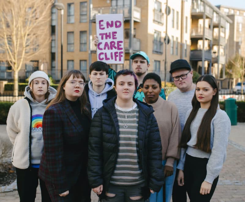 group of young people with end the care cliff sign