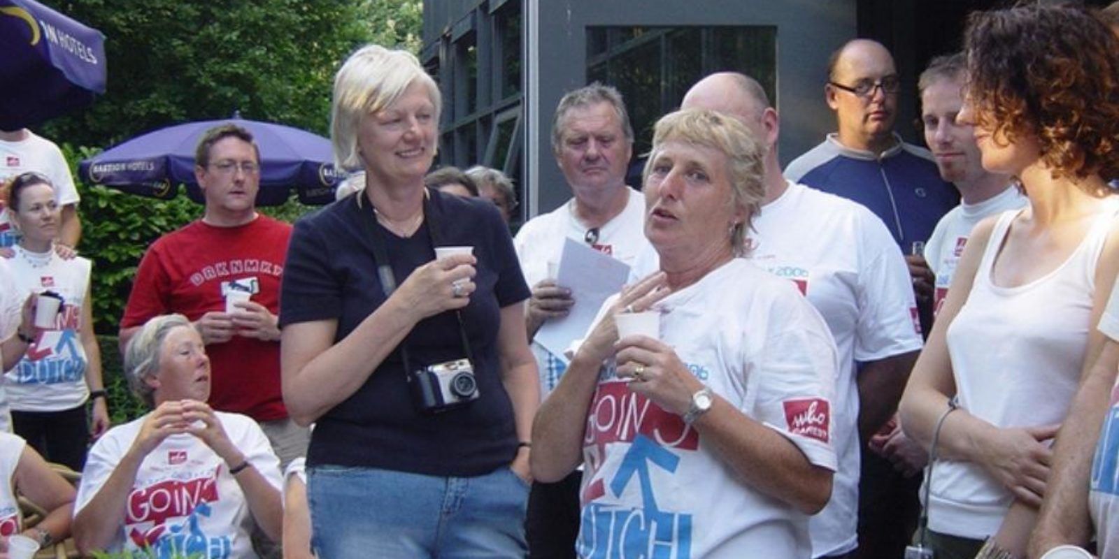 Gill and Peggy speak to a crowd of cyclists