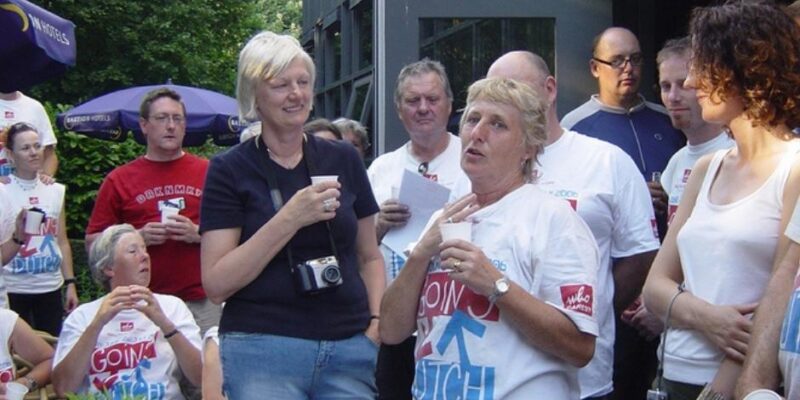 Gill and Peggy speak to a crowd of cyclists