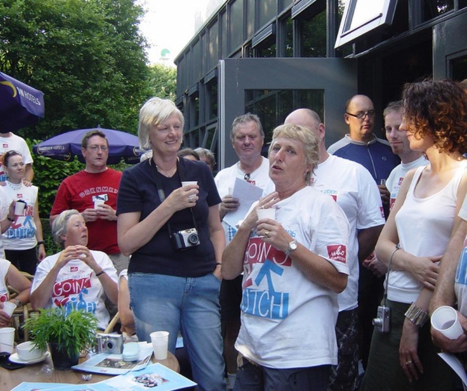 Gill and Peggy speak to a crowd of cyclists