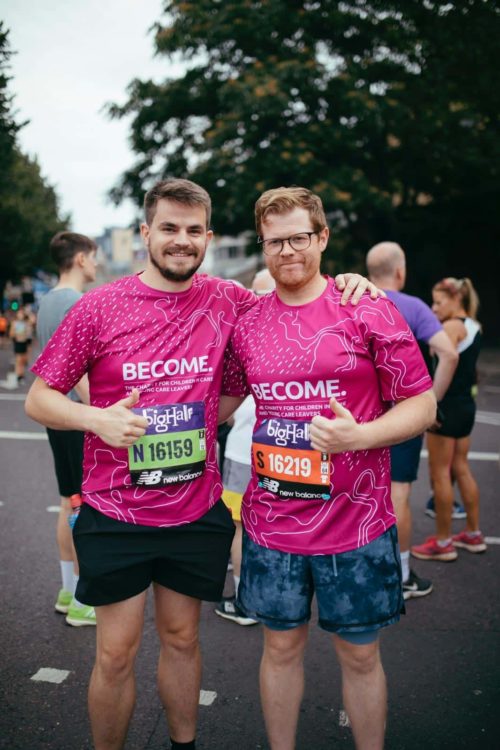 Two people at The Big Half wearing Become running top