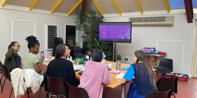 Training session - group sitting round a table